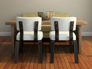 small walnut dining room table with two white upholstered chairs with black legs and green dining bench seat